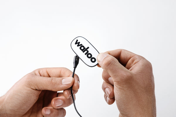 A Wahoo Trackr rechargeable HRM being plugged in